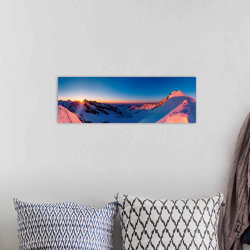 A bohemian room featuring Panoramic view of Aletschorn at sunrise with red light. Aletschorn, Vallese.