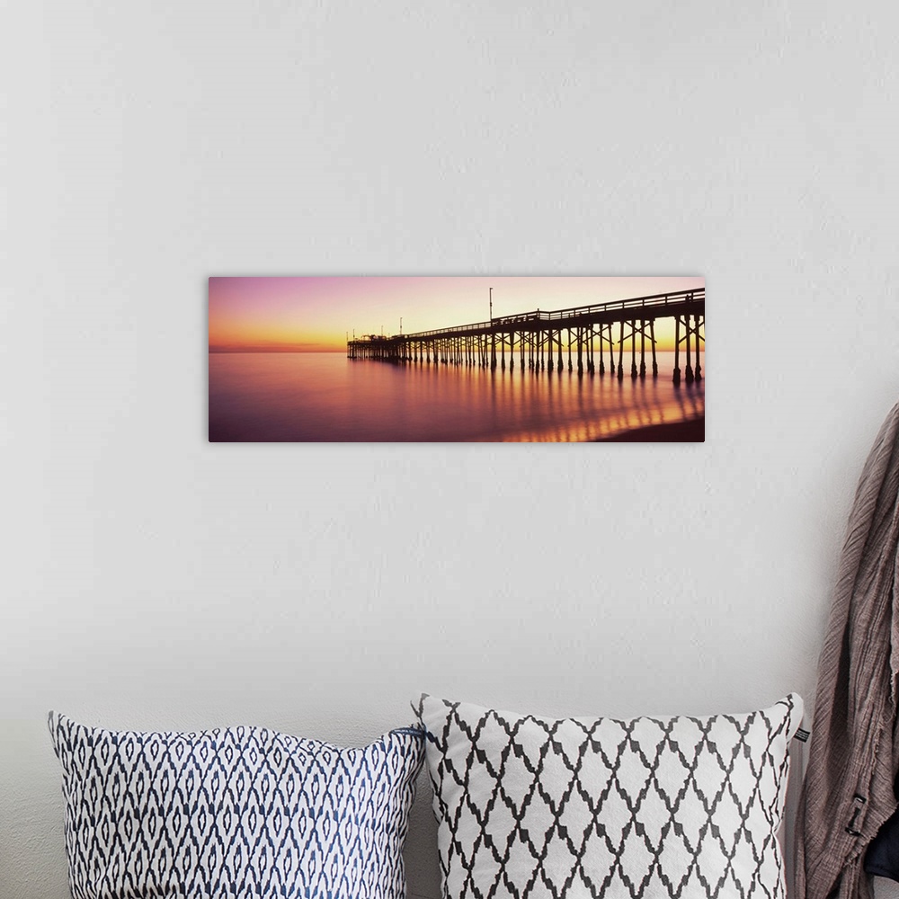 A bohemian room featuring Balboa Pier at sunset, Newport Beach, Orange County, California, USA