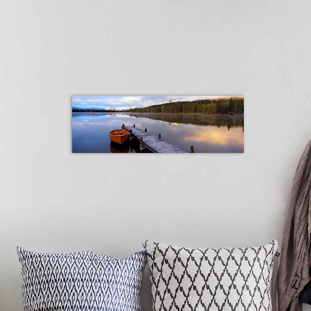 A bohemian room featuring Panoramic photograph of creek with canoe tied to a pier.  There are trees on both sides of the cr...