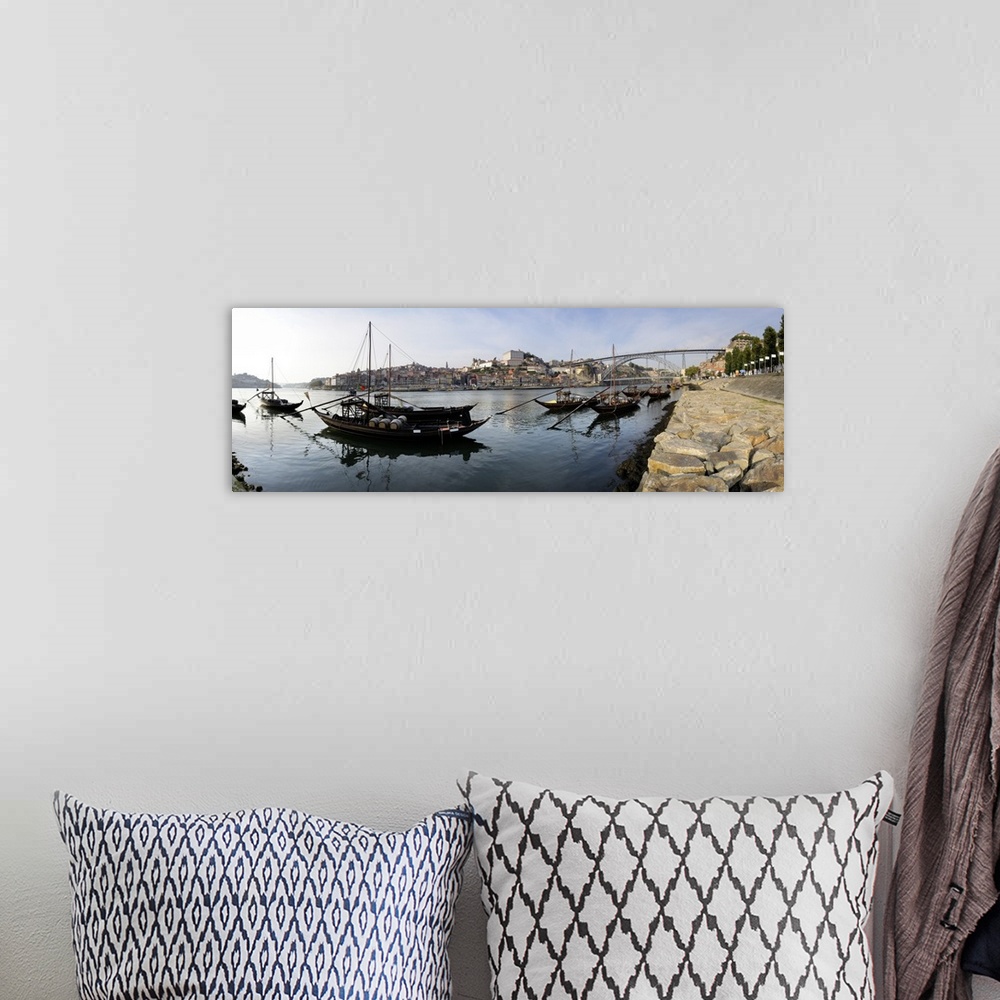 A bohemian room featuring Boats in a river Dom Luis I Bridge Duoro River Porto Portugal