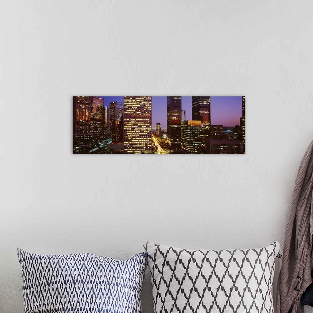 A bohemian room featuring Panoramic, close up photograph of lit skyscrapers at night, in Los Angeles, California, a vivid s...