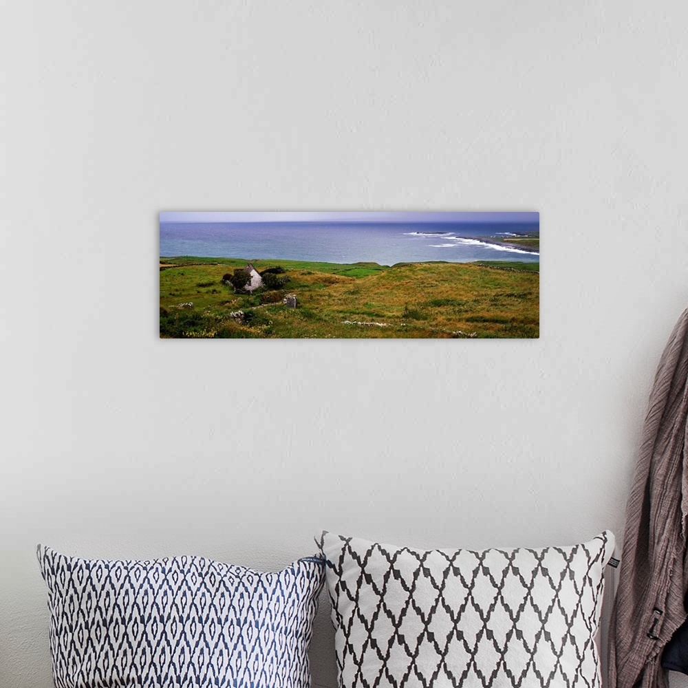 A bohemian room featuring Coastal landscape with white stone house, Galway Bay, The Burren region, Ireland