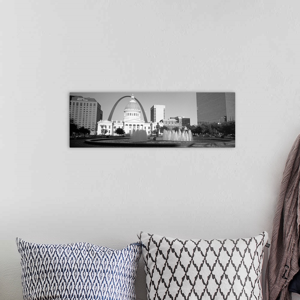 A bohemian room featuring A panoramic view of St. Louis Missouri's capitol building, with the Saint Louis arch in the backg...