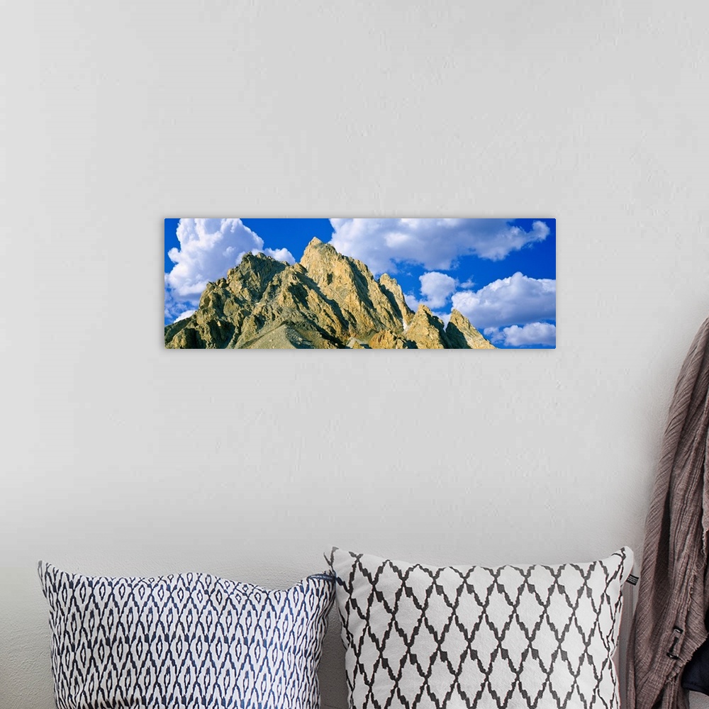 A bohemian room featuring Low angle view of clouds over mountain peak, Exum Ridge, Grand Teton National Park, Wyoming, USA.
