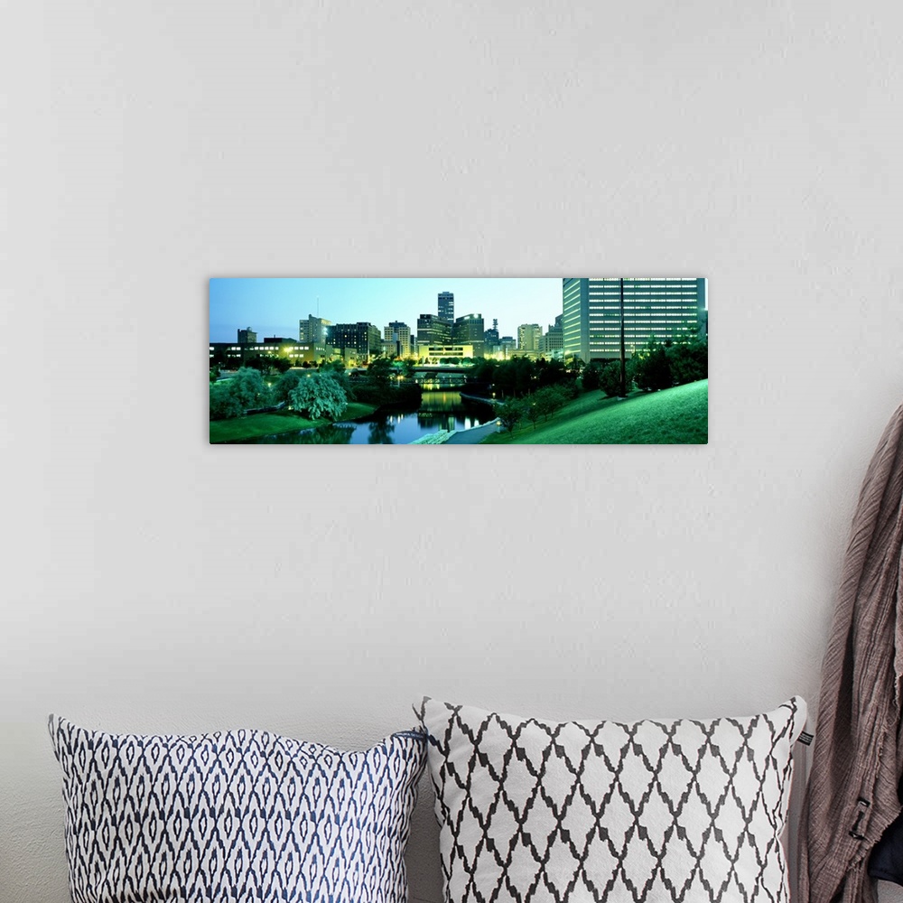 A bohemian room featuring Photograph taken of the city skyline in Omaha Nebraska during dusk with the buildings lit up and ...