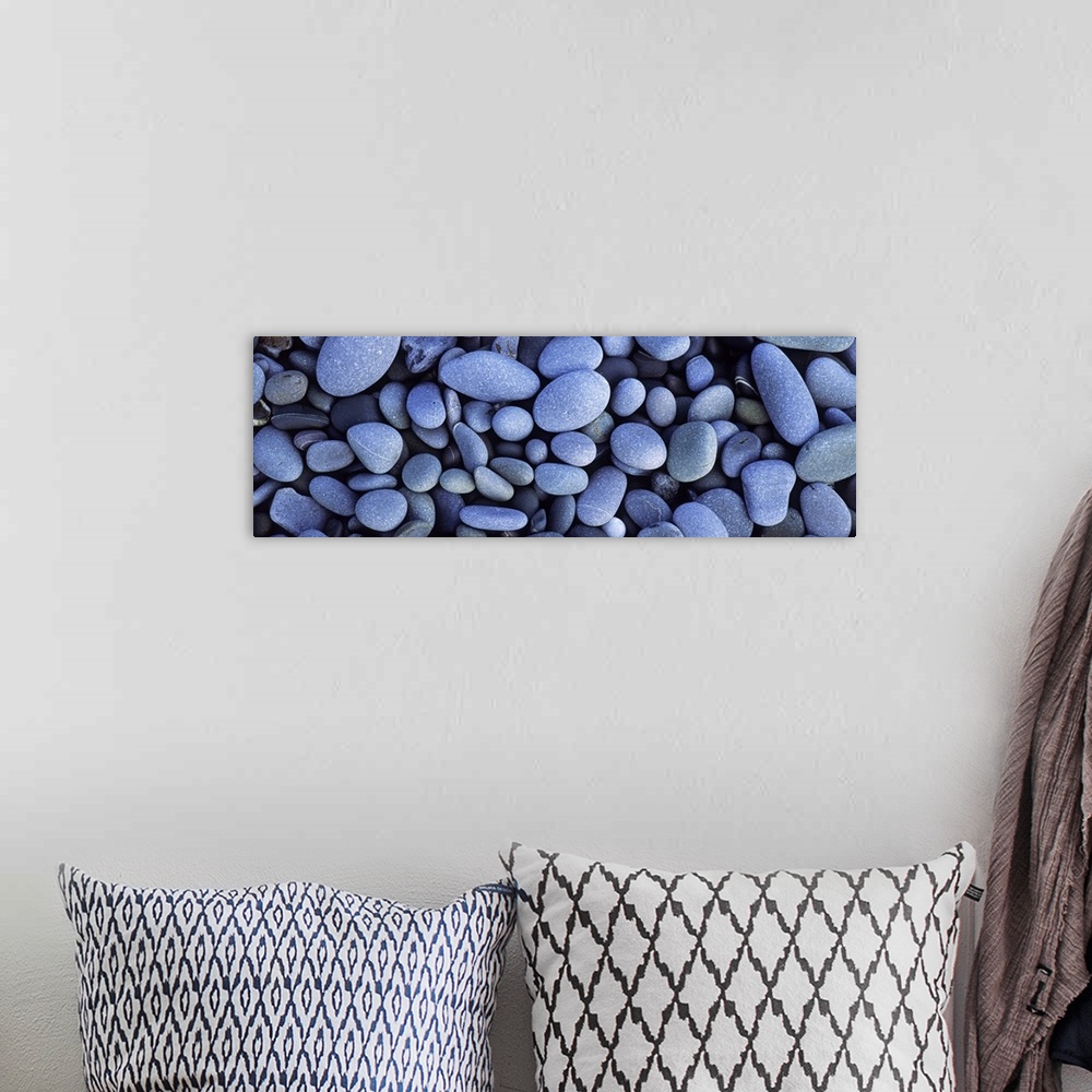 A bohemian room featuring Close up horizontal photograph of smooth pebbles in various sizes, on Sandymouth Beach in Cornwal...