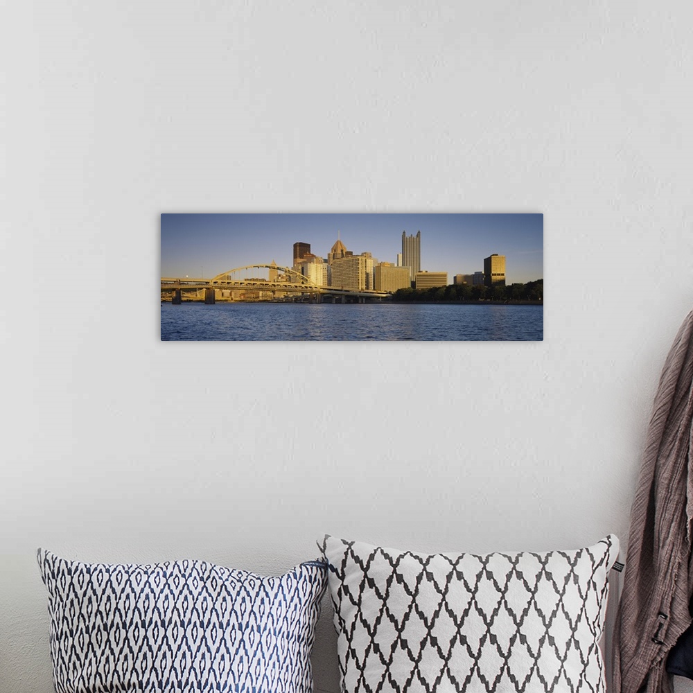 A bohemian room featuring Giant, panoramic photograph of the Pittsburgh skyline, and the Fort Pitt Bridge in the foreground...