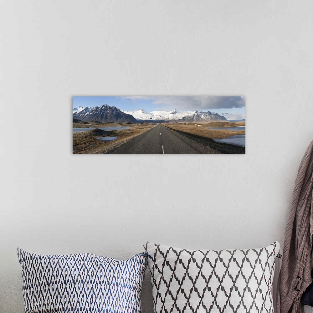 A bohemian room featuring Road with mountains in the background Iceland