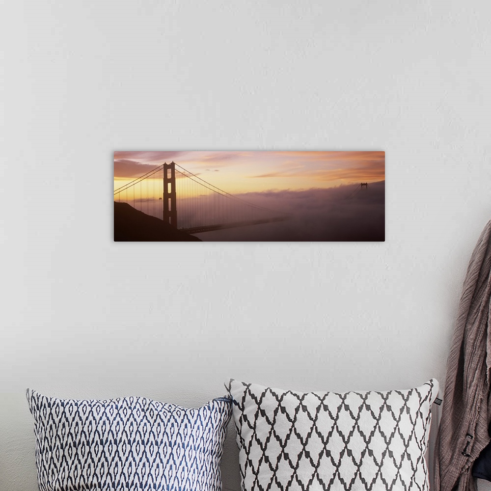 A bohemian room featuring Panoramic photo on canvas of the silhouette of the Golden Gate Bridge coming out of the fog at su...