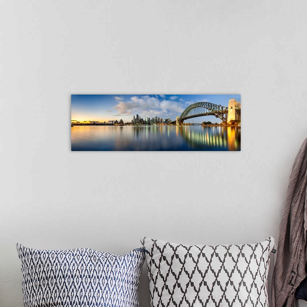 A bohemian room featuring Sydney Harbour Bridge and skylines at dusk, Sydney, New South Wales, Australia.