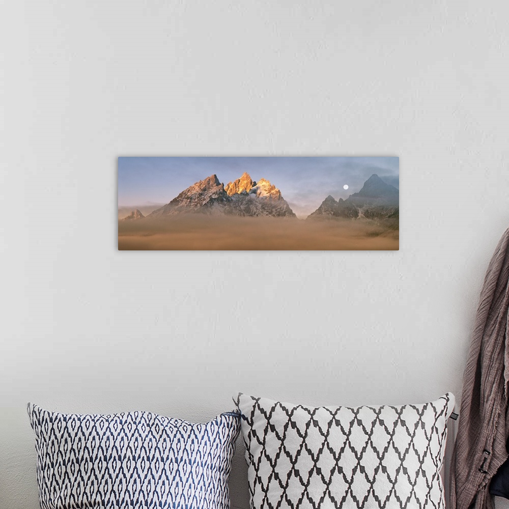 A bohemian room featuring The Teton peaks catch first light above the valley fog, Grand Teton National Park, Teton County, ...