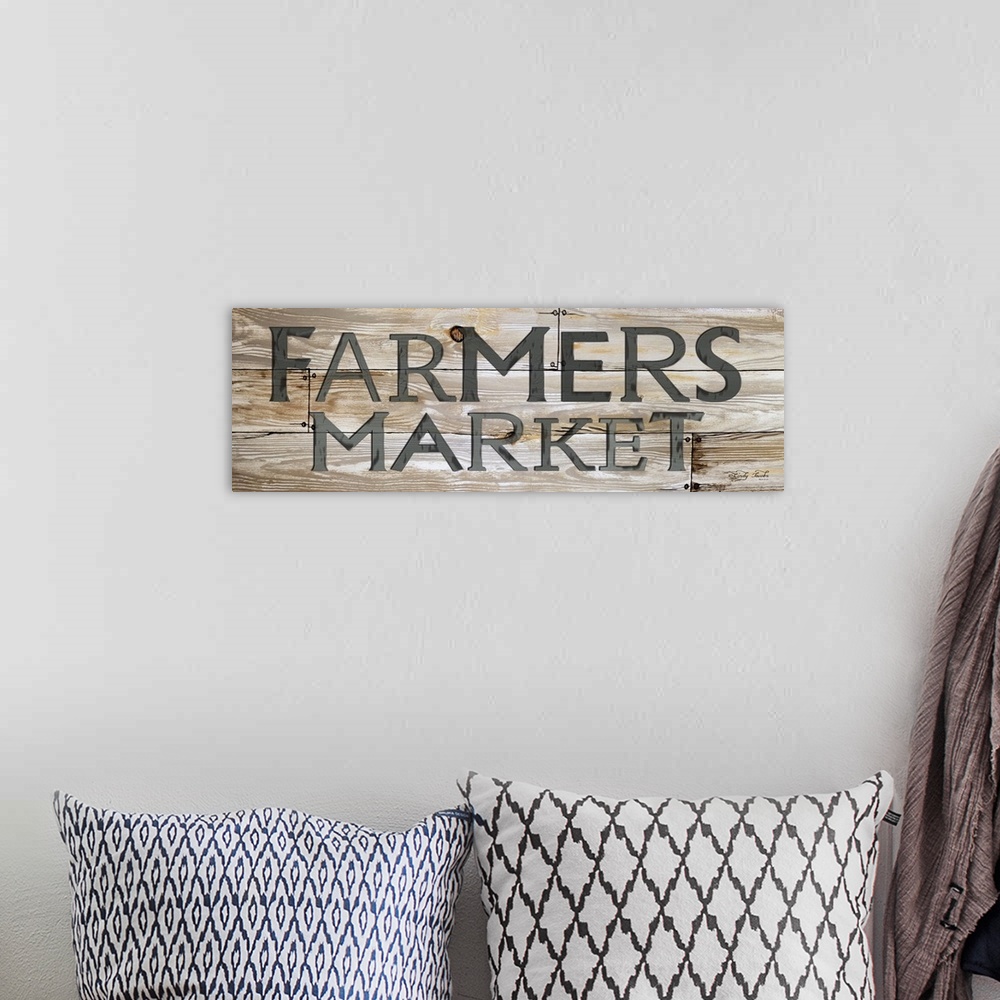 A bohemian room featuring Vintage style sign for a Farmer's Market with a weathered effect.