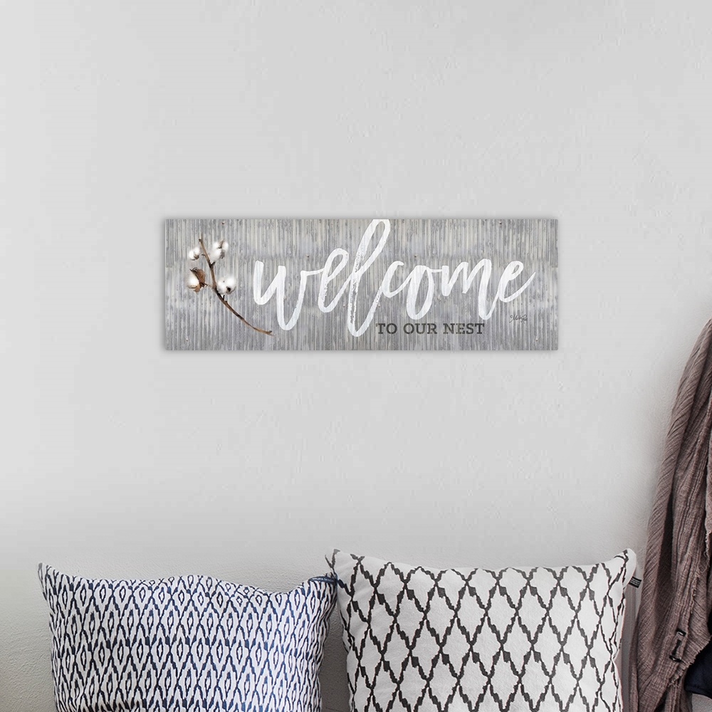 A bohemian room featuring "Welcome to Our Nest" on a gray distressed metal background.