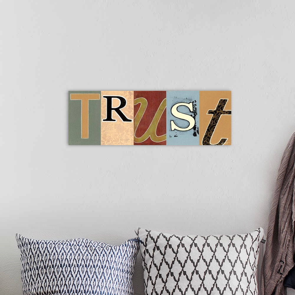 A bohemian room featuring Decorative image of the word "Trust" with each letter painted in a different font and color.
