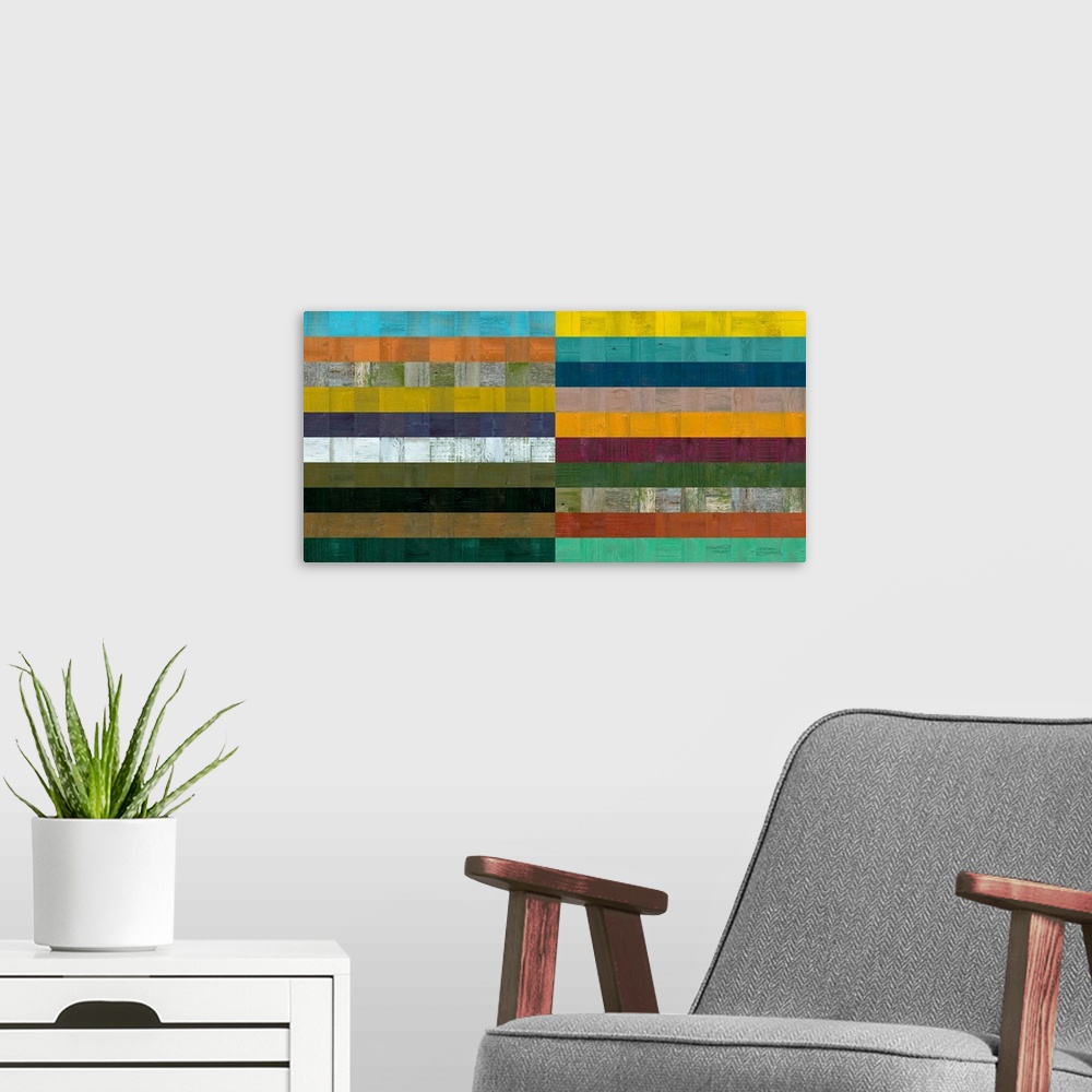A modern room featuring Contemporary geometric home decor artwork in various colors.