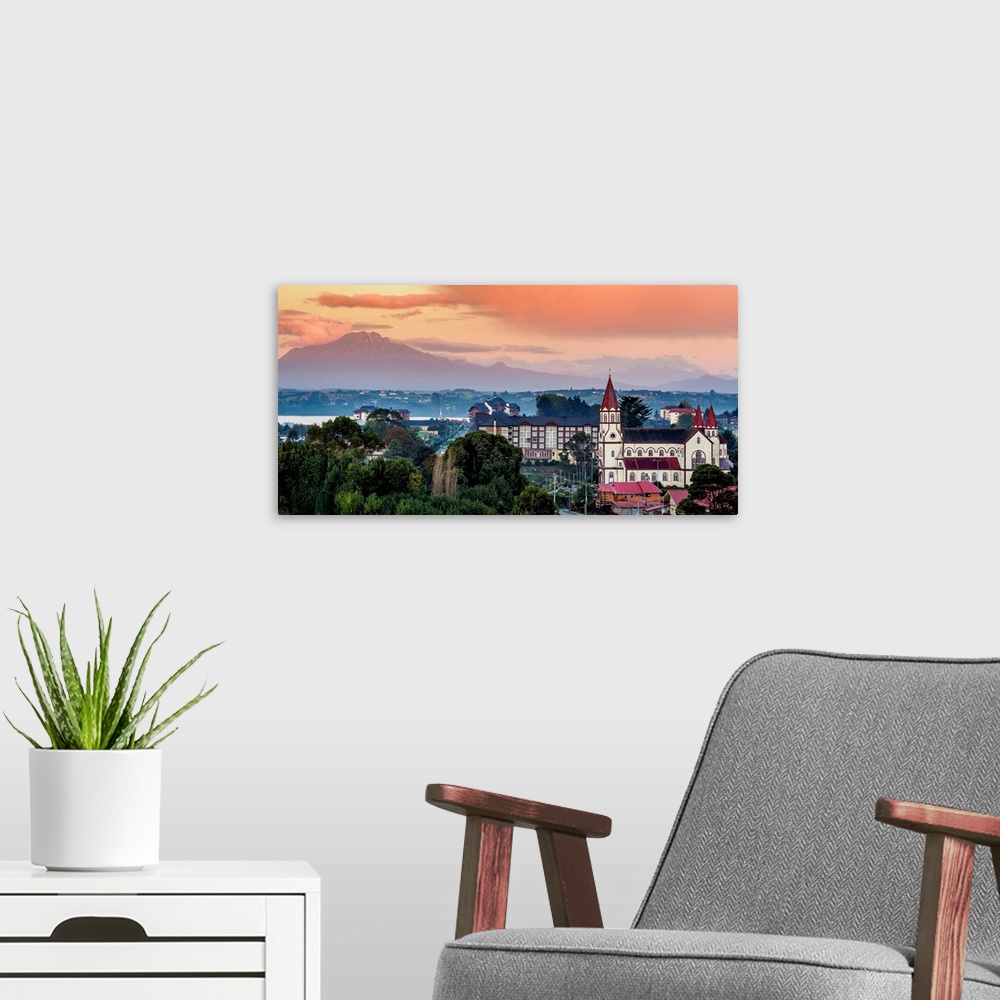 A modern room featuring Church and Calbuco Volcano at sunset, Puerto Varas, Llanquihue Province, Los Lagos Region, Chile.