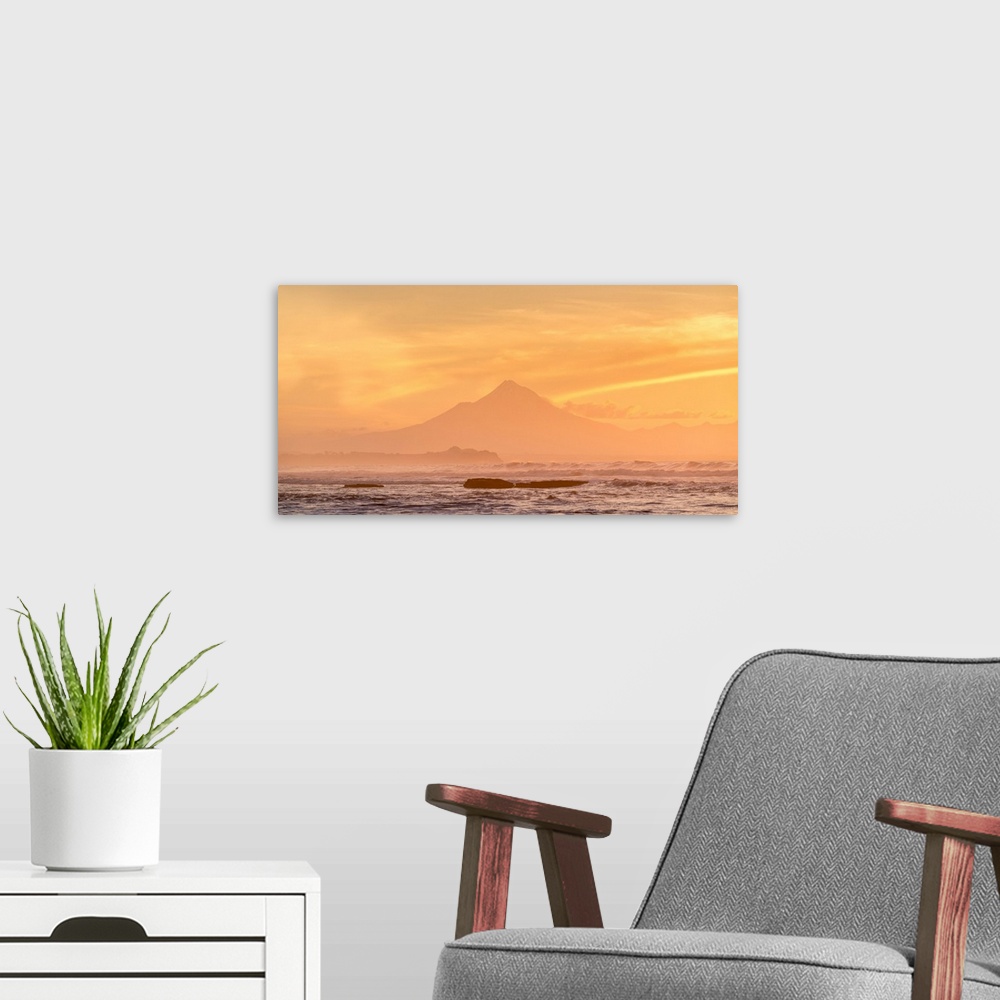A modern room featuring Silhouette of Mount Taranaki at sunset. Tongaporutu, New Plymouth district. Taranaki region, Nort...