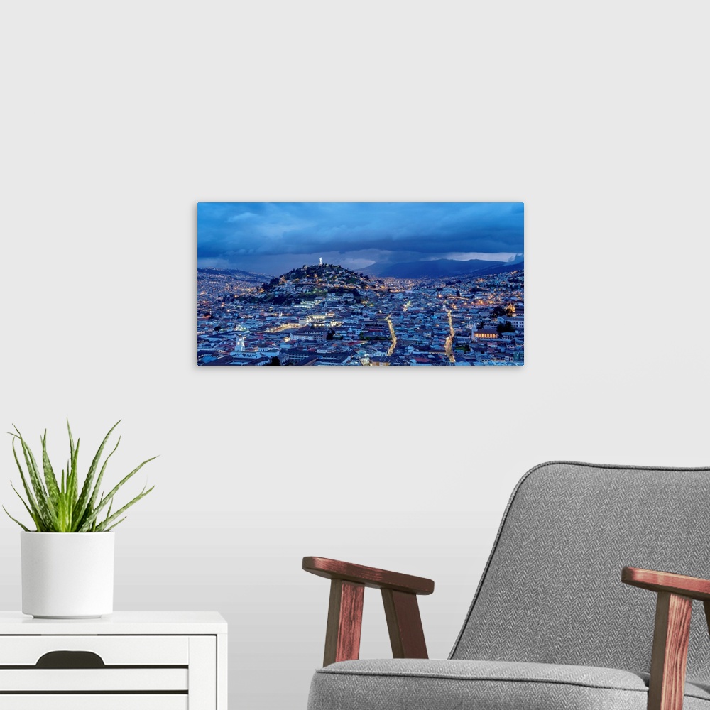 A modern room featuring View over Old Town towards El Panecillo Hill at twilight, Quito, Pichincha Province, Ecuador.