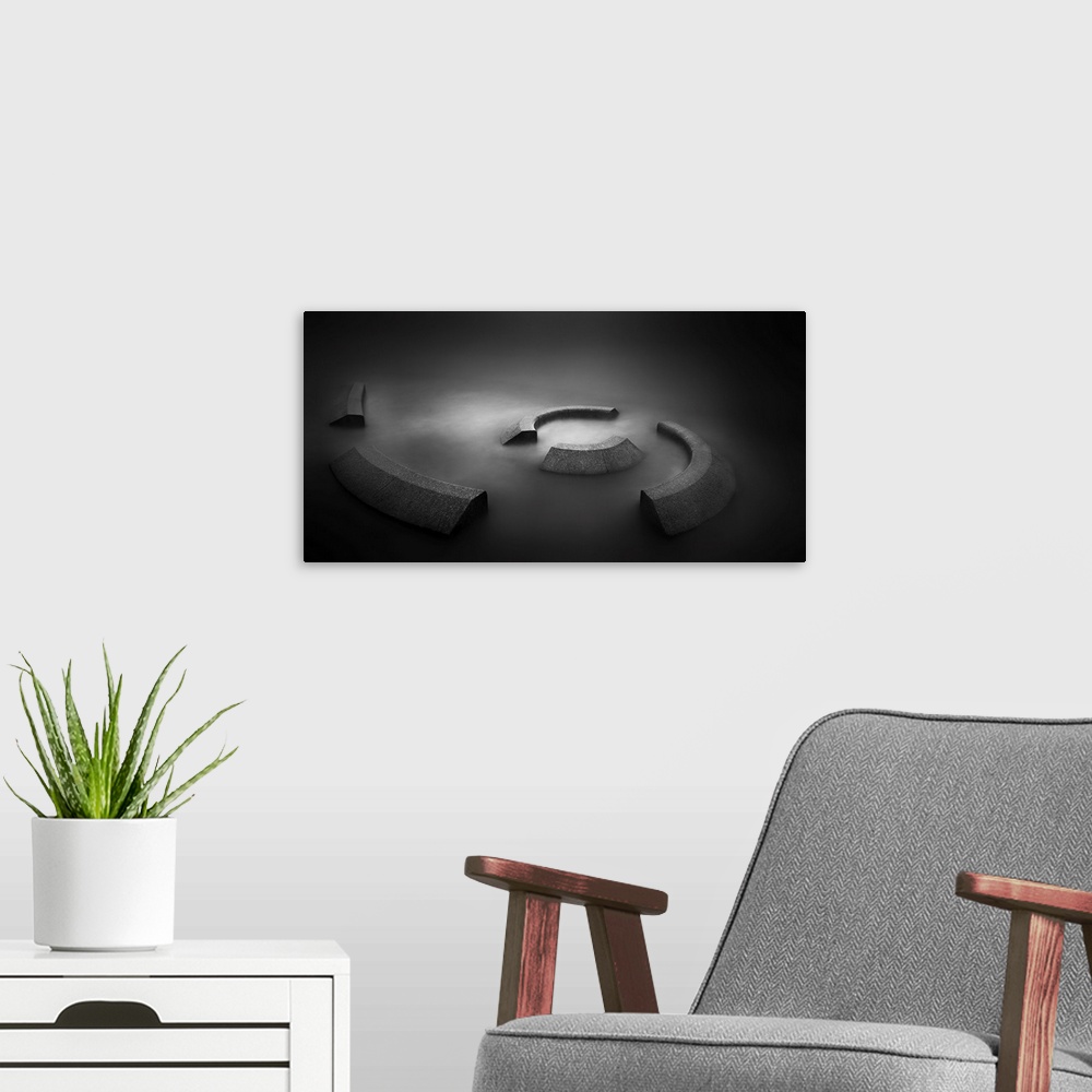 A modern room featuring A contemporary dramatic monochrome black and white intense image of a spiral concrete installatio...