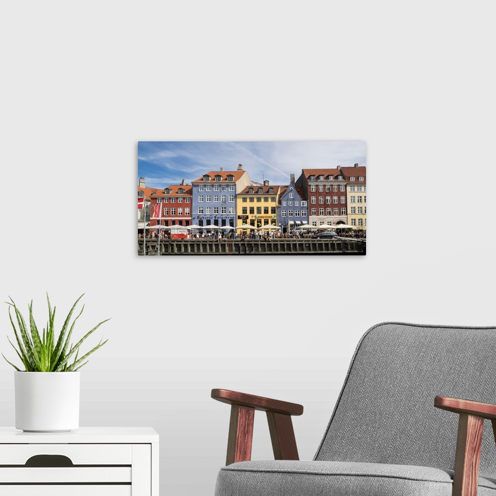 A modern room featuring Colorful houses in the city along Nyhavn, Copenhagen, Denmark