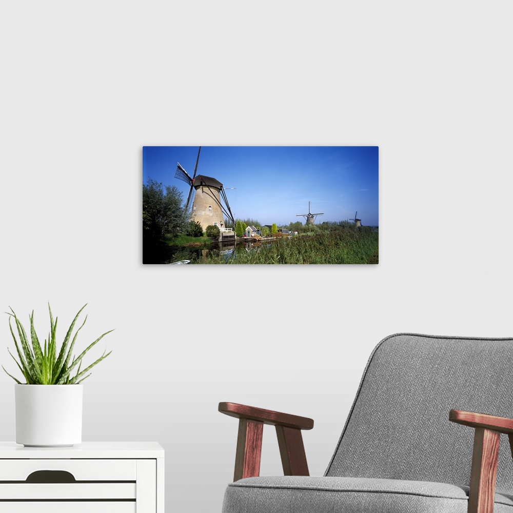 A modern room featuring Traditional windmills in a field, Netherlands