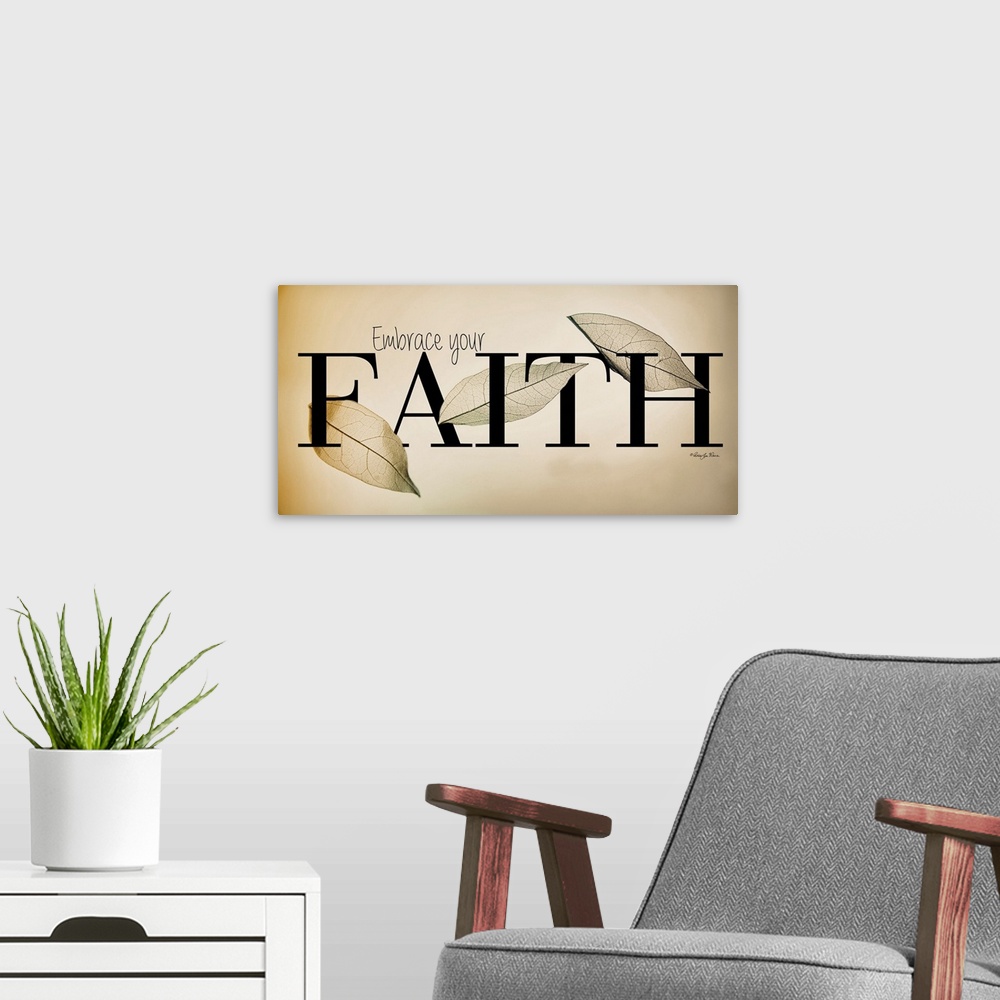 A modern room featuring Religious typography art with a leaf design on neutral colors.