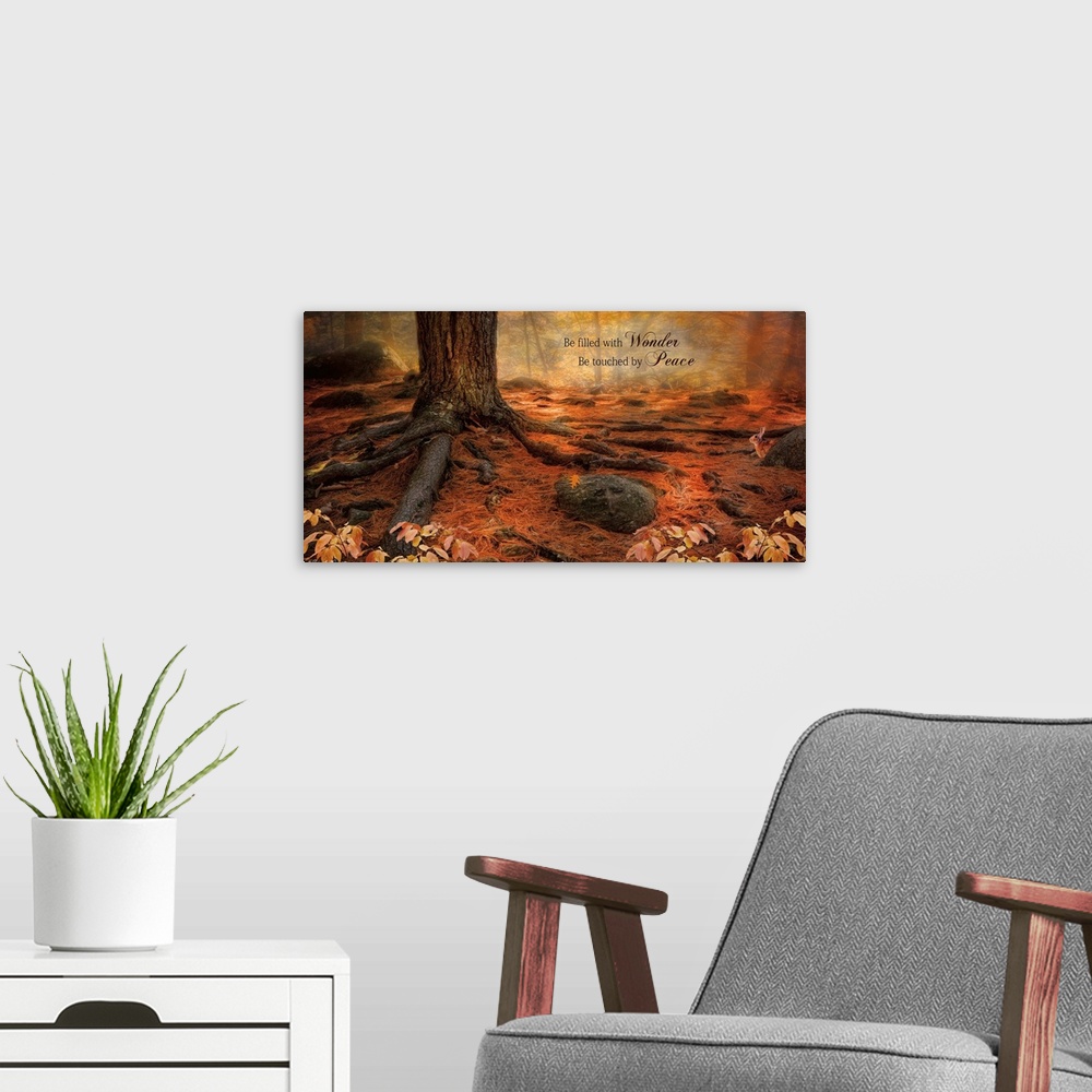A modern room featuring Inspirational sentiment over an image of a forest floor covered in tree roots and fallen autumn l...