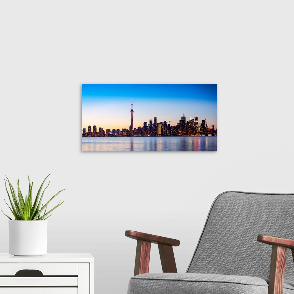 A modern room featuring Photo of Toronto city skyline at sunset, Ontario, Canada.