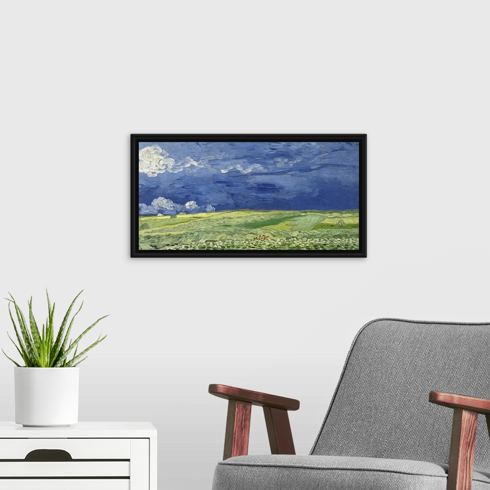 A modern room featuring Vincent van Gogh - Wheatfield under thunderclouds.