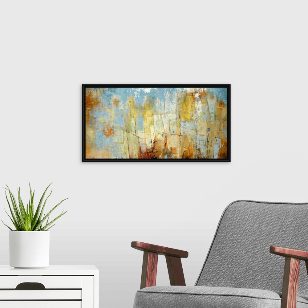 A modern room featuring Oversized landscape contemporary art with patchy areas of varying rust colored shapes on a blue b...