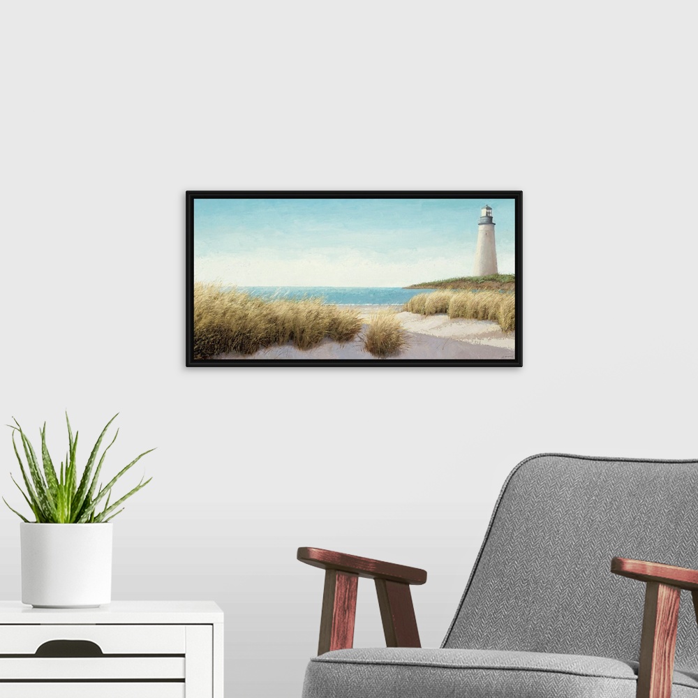 A modern room featuring Horizontal, large wall picture of grasses blowing on the beach.  A lighthouse in the distance, ne...