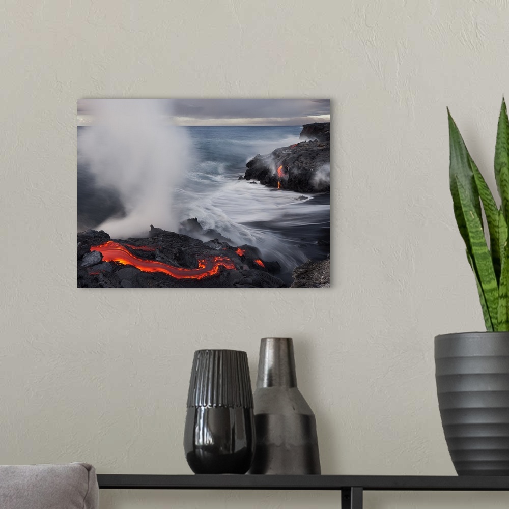 A modern room featuring Lava flowing into the ocean, creating large amounts of steam, Hawaii.