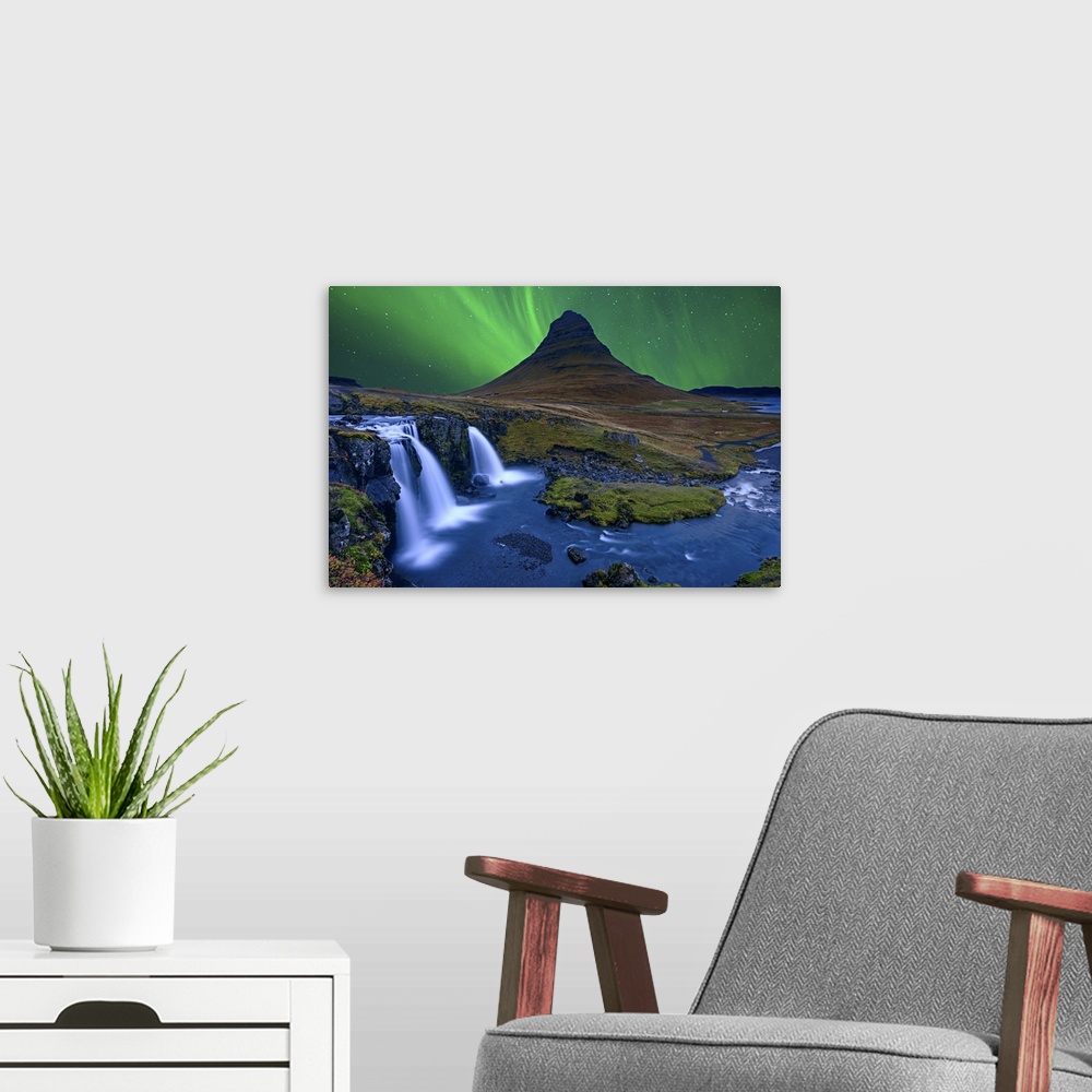A modern room featuring Northern lights over Kirkjufellfoss, with a stunning waterfall in the foreground.