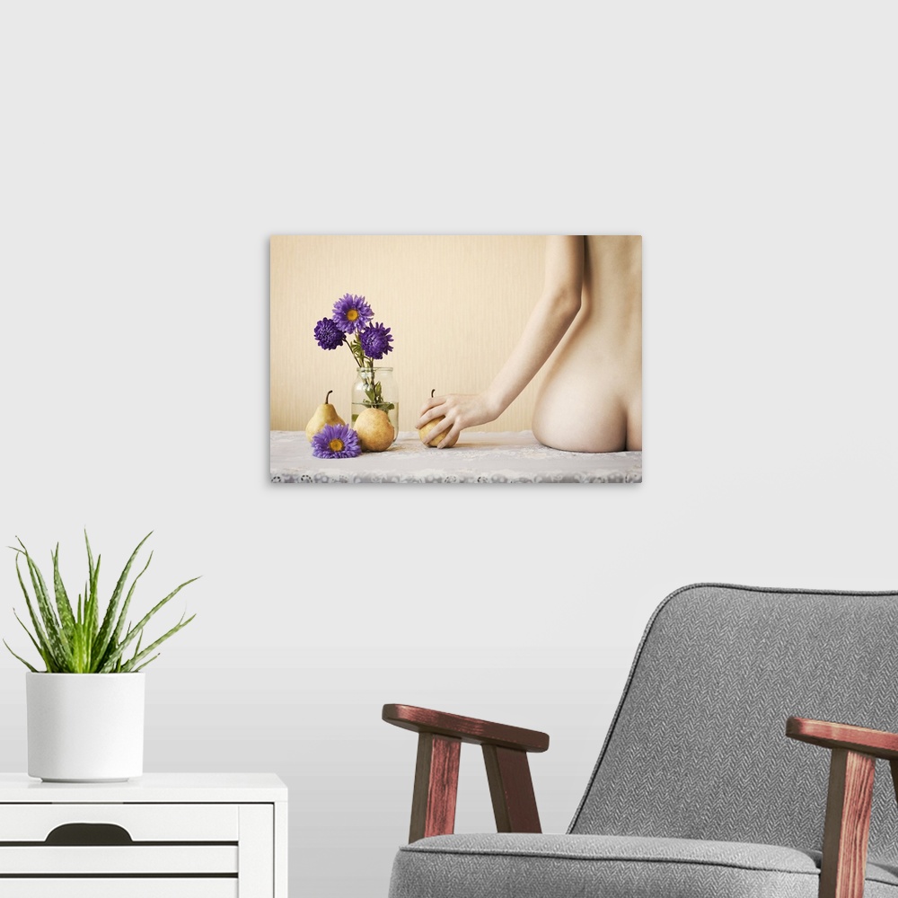 A modern room featuring A nude woman's derriere mimics the pears next to her.