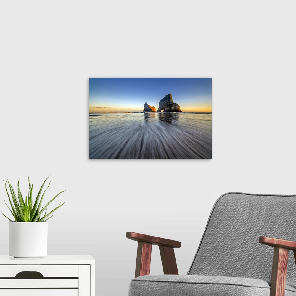 A modern room featuring Long exposure landscape photograph of Wharaiki Beach, New Zealand