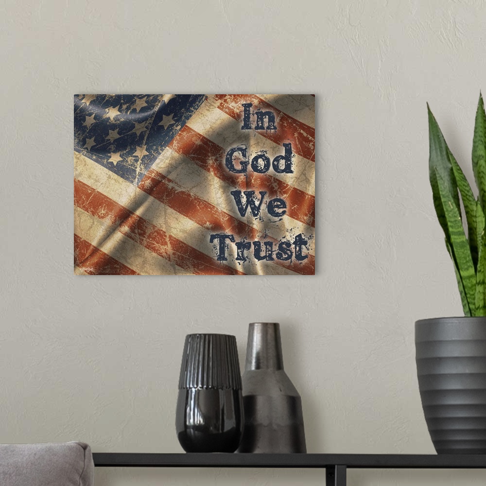 A modern room featuring "In God We Trust" on a rustic waiving American flag.