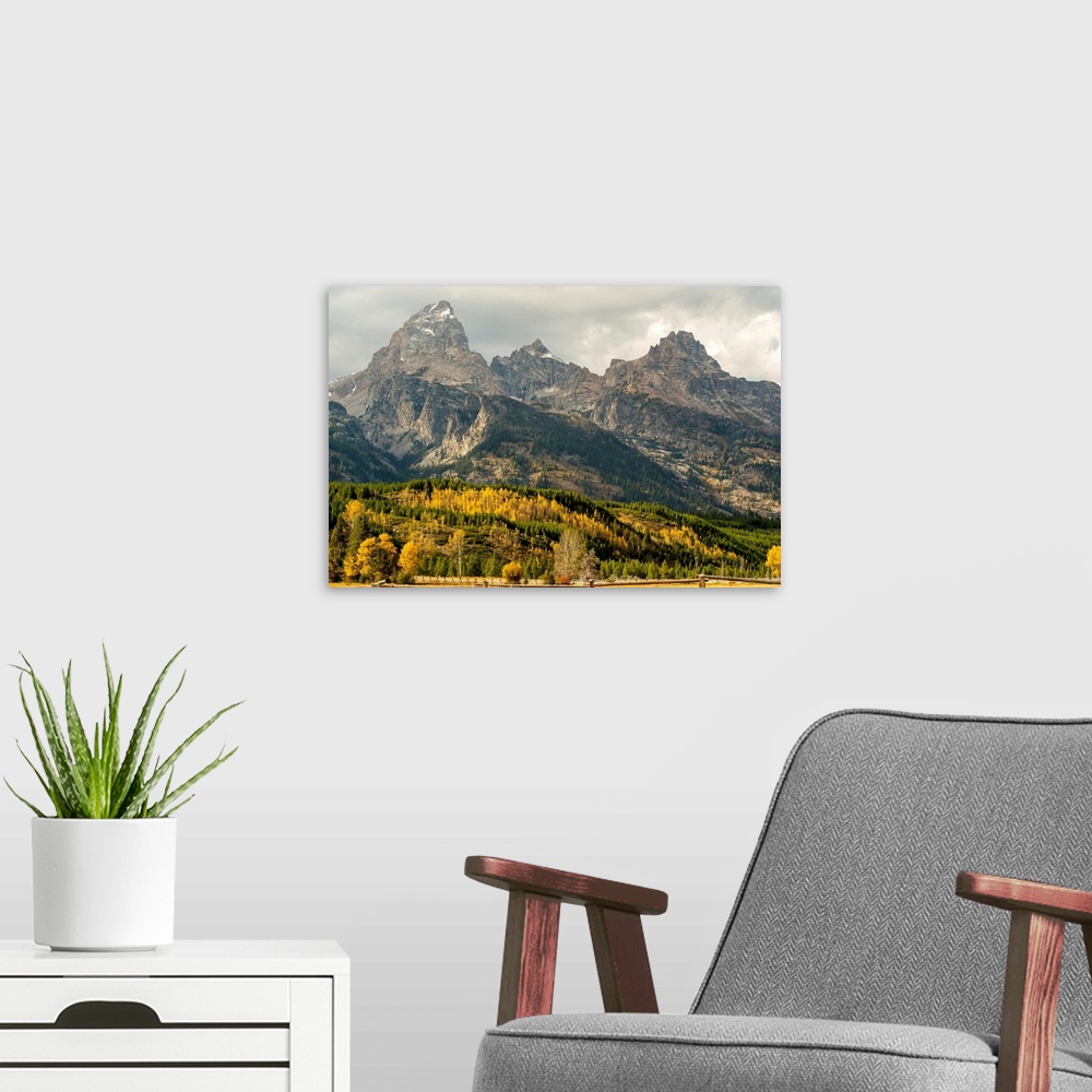 A modern room featuring Grand Teton range in autumn, Grand Teton National Park; Wyoming, United States of America
