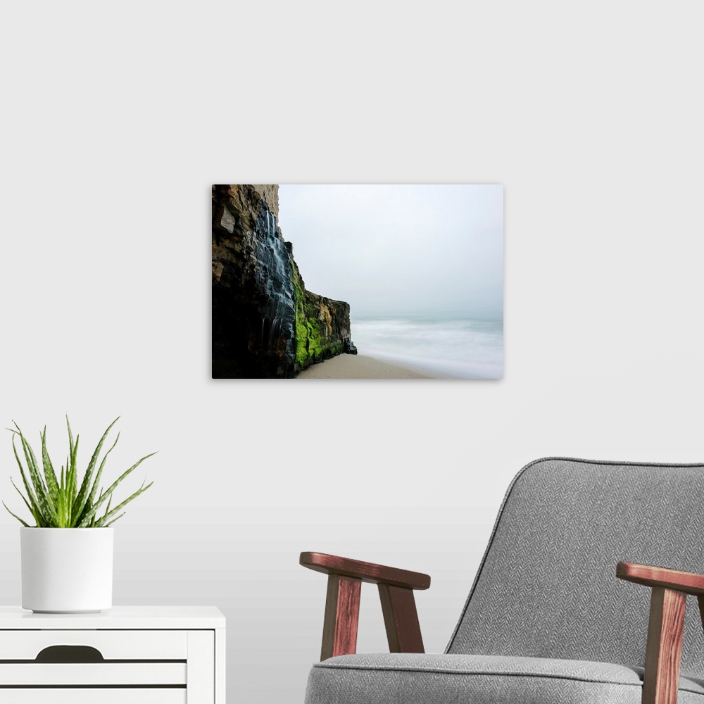 A modern room featuring Waterfall over the rugged cliff along the beach and coast at Wilder Ranch State Park Santa Cruz, ...