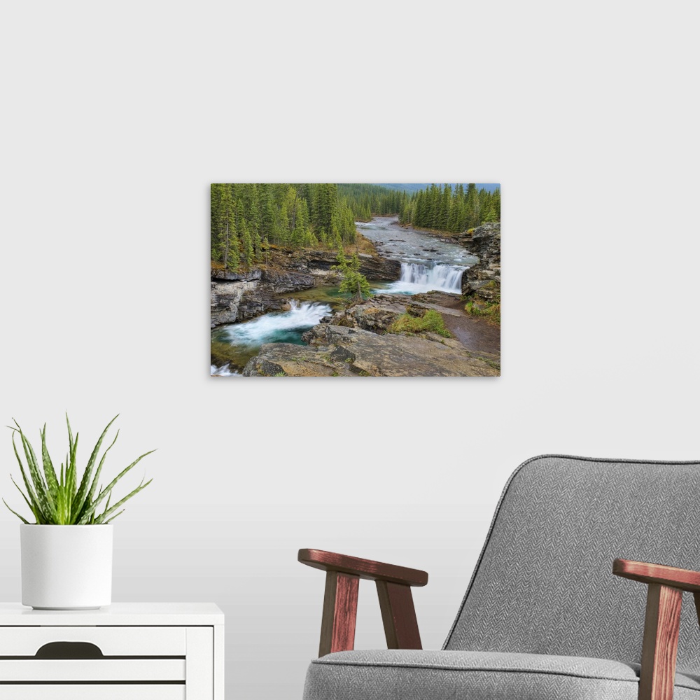 A modern room featuring Waterfall In The Canadian Rocky Mountains; Kananaskis, Alberta, Canada