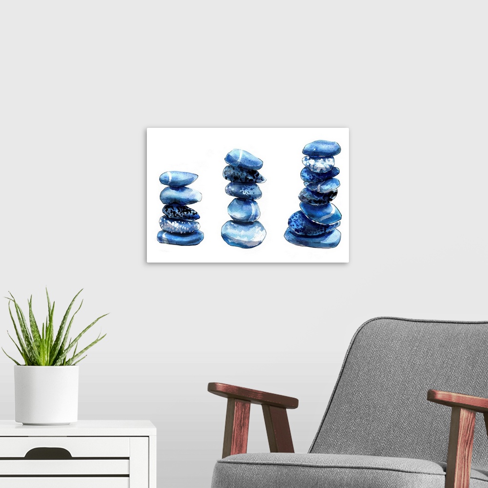 A modern room featuring Contemporary artwork of three stacks of round blue pebbles.