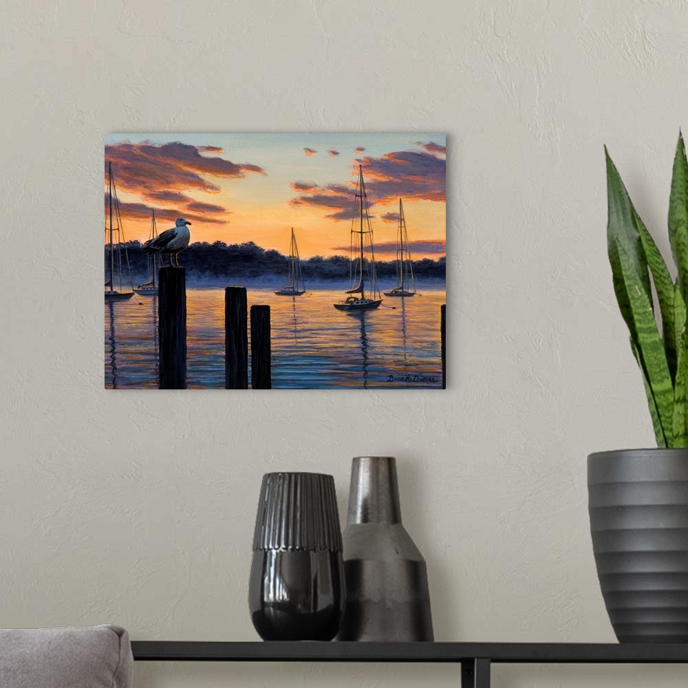 A modern room featuring Contemporary artwork of seagull and sailboats at sunset.