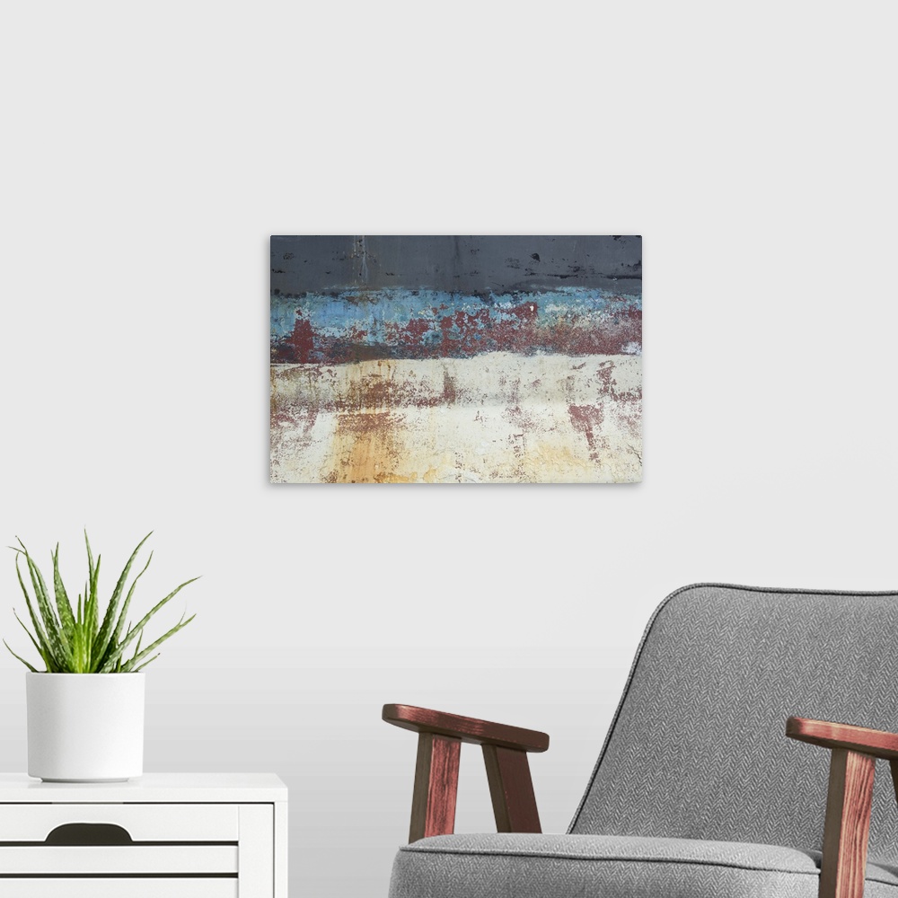 A modern room featuring An artistic photograph of a close abstract view of a ships hull looking weathered and rusty.