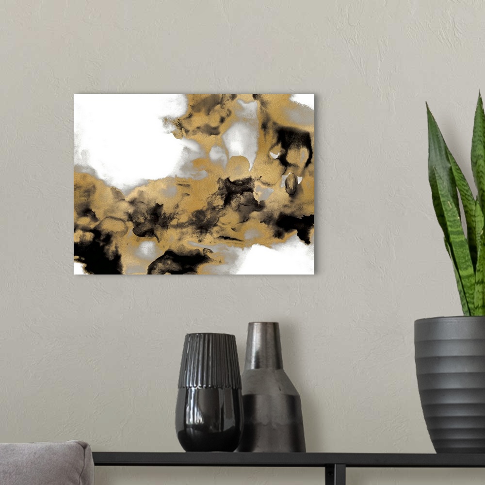 A modern room featuring Abstract art with metallic silver and gold with black splotches on a solid white background.