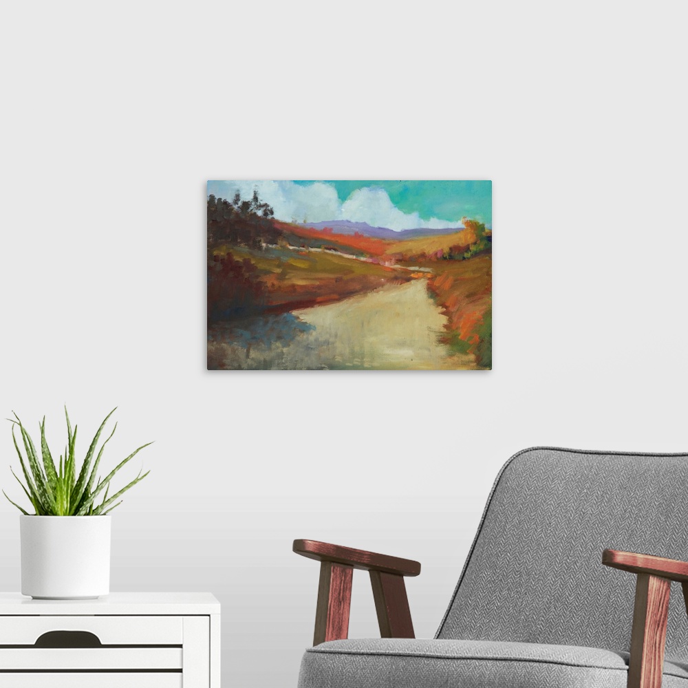 A modern room featuring Contemporary landscape painting of a road leading through colorful hills and trees.