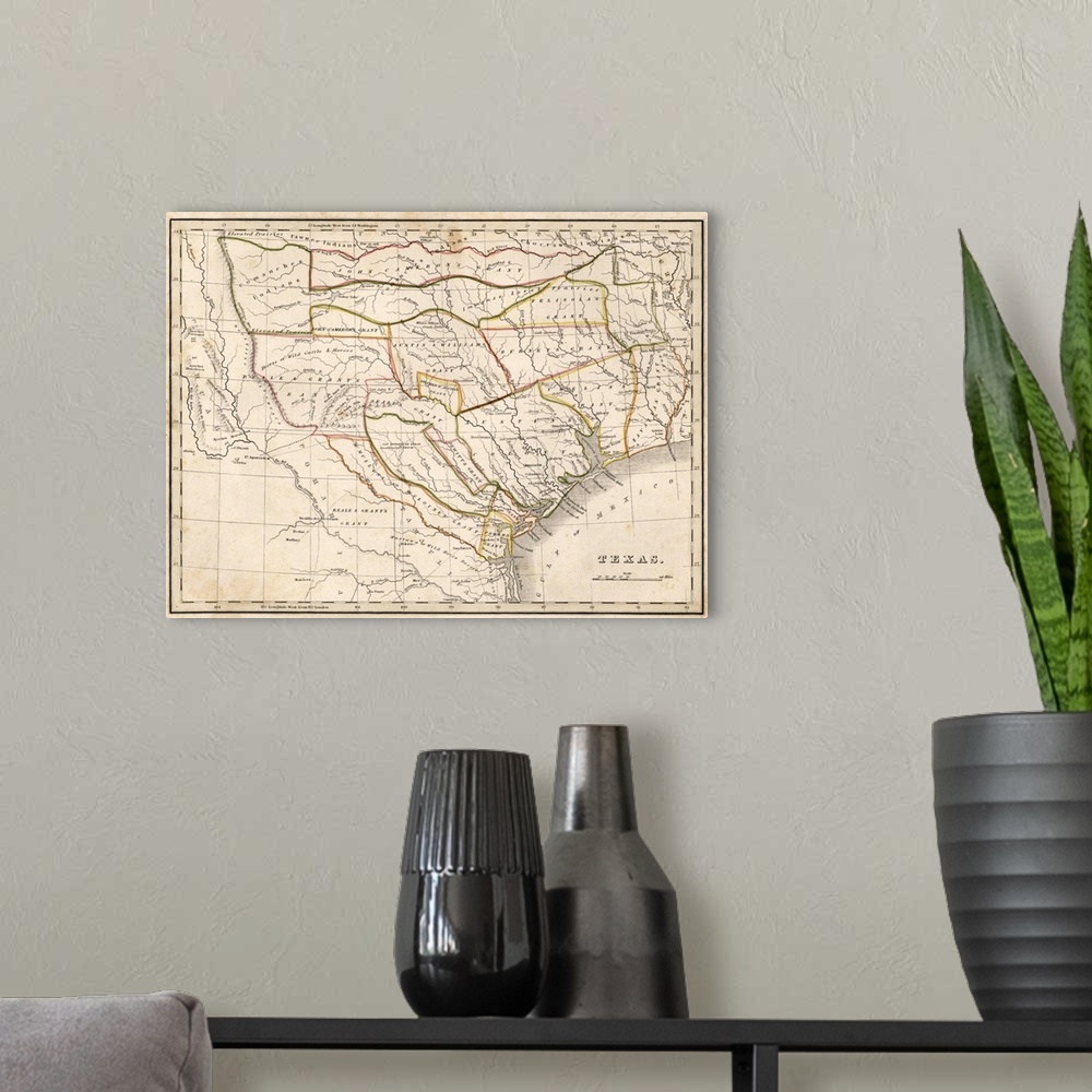 A modern room featuring Antique historical map of Texas with highlighted boarders.