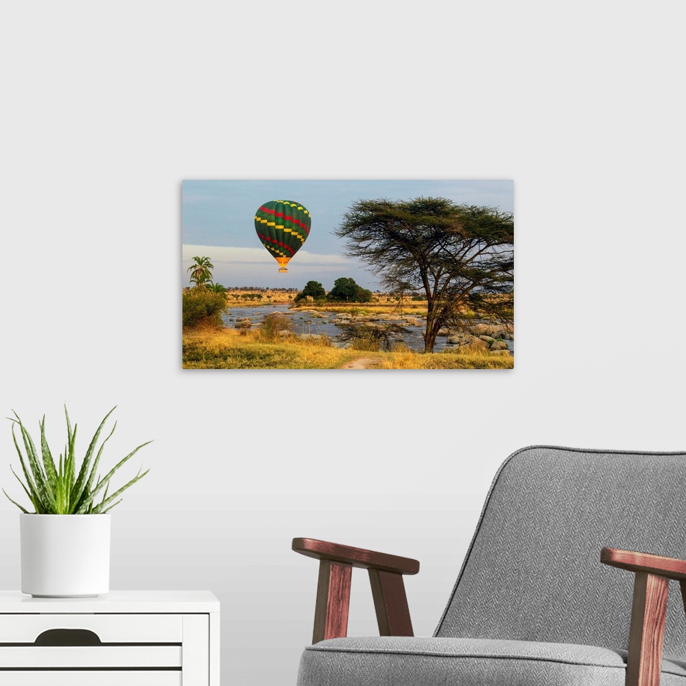 A modern room featuring Africa. Tanzania. Hot air balloon crossing the Mara river in Serengeti NP.