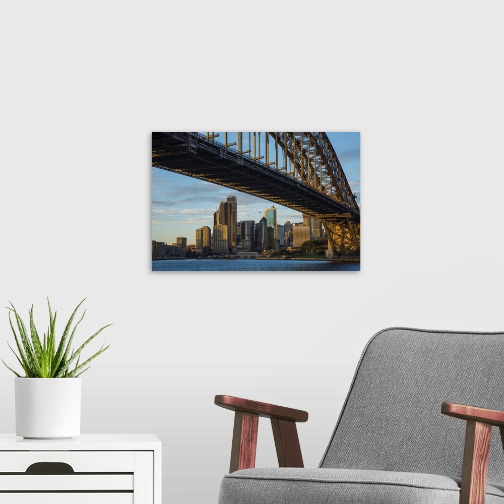 A modern room featuring Australia, Sydney. View beneath bridge of city.