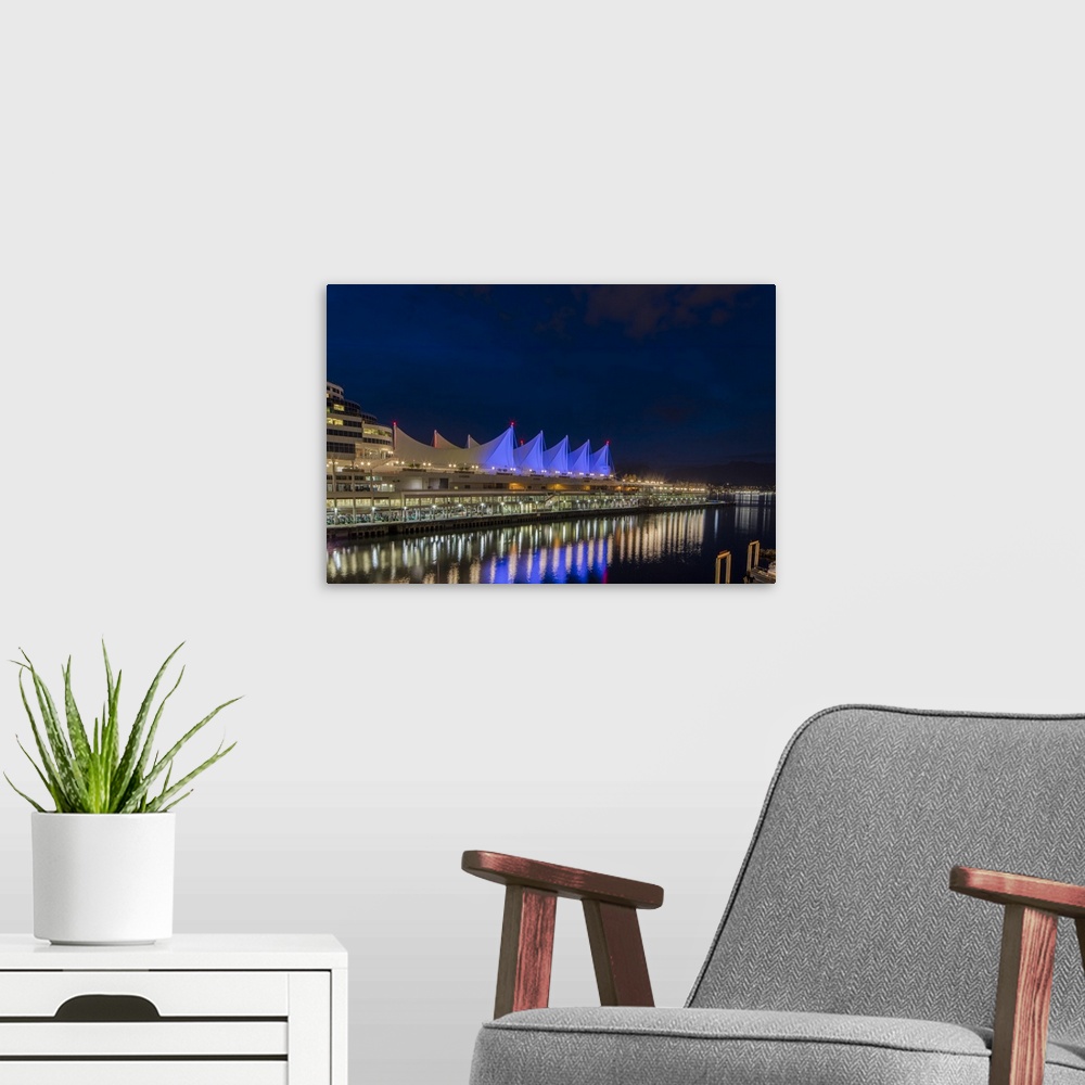 A modern room featuring Canada Center lights reflect in harbor in Vancouver, Bitish Columbia, Canada