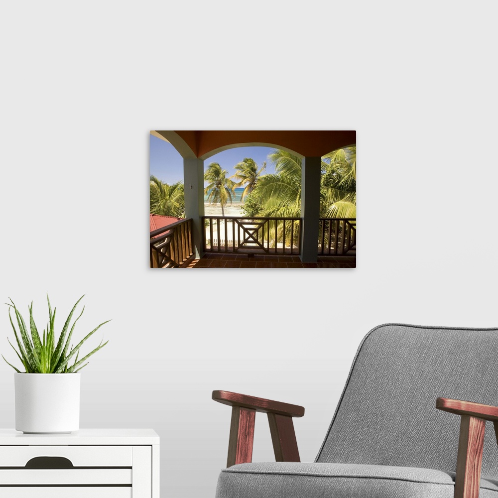 A modern room featuring Caribbean, Puerto Rico, Vieques.  Caribbean, beach and palm trees, viewed from porch of house/hot...