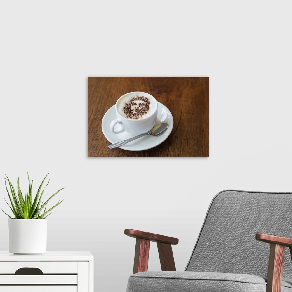 A modern room featuring Cuba. Che Guevara is stenciled in cinnamon atop a cup of cappucino.